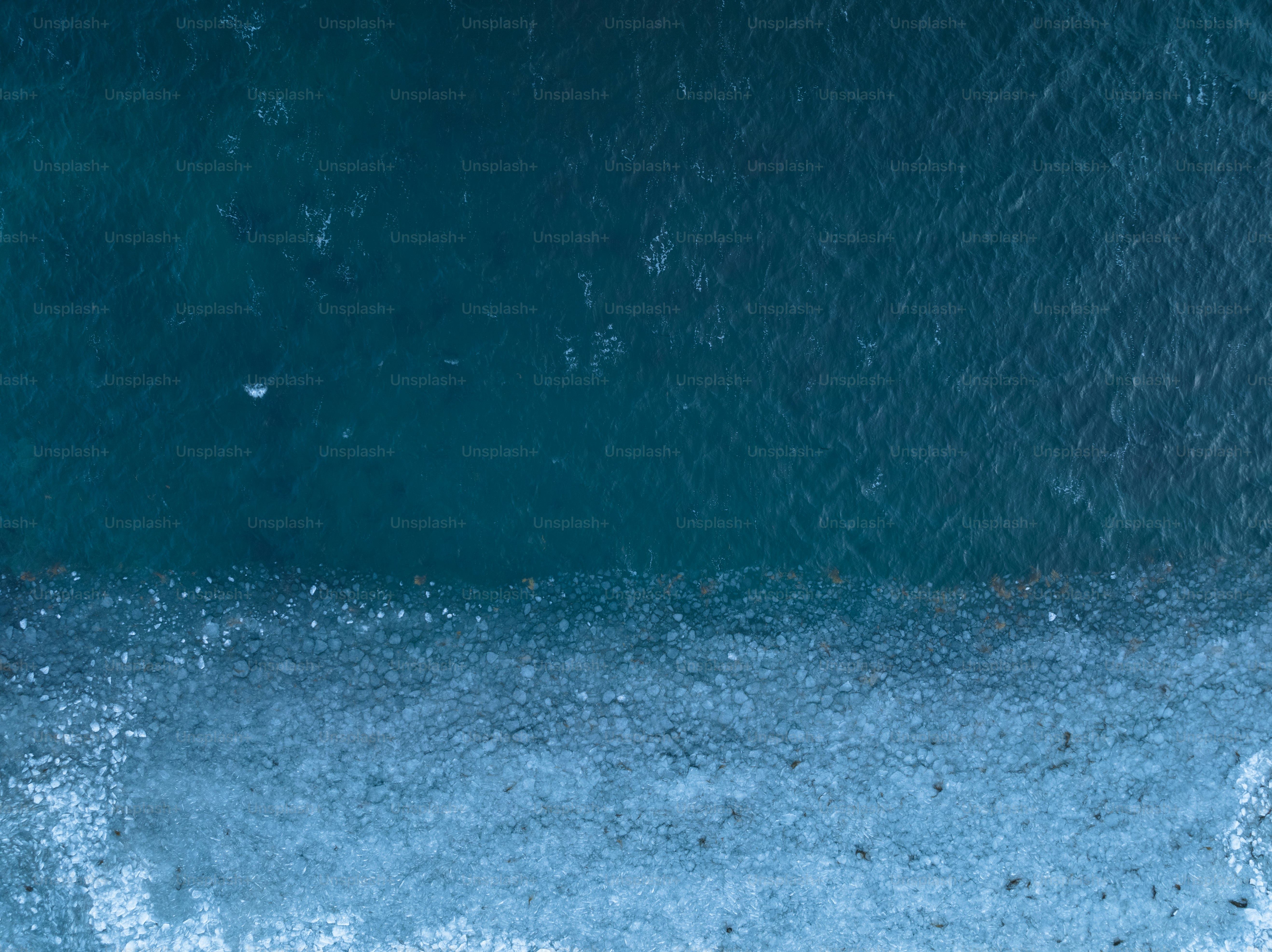 a man riding a surfboard on top of a wave
