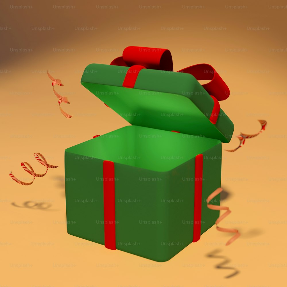 Una caja de regalo verde con una cinta roja