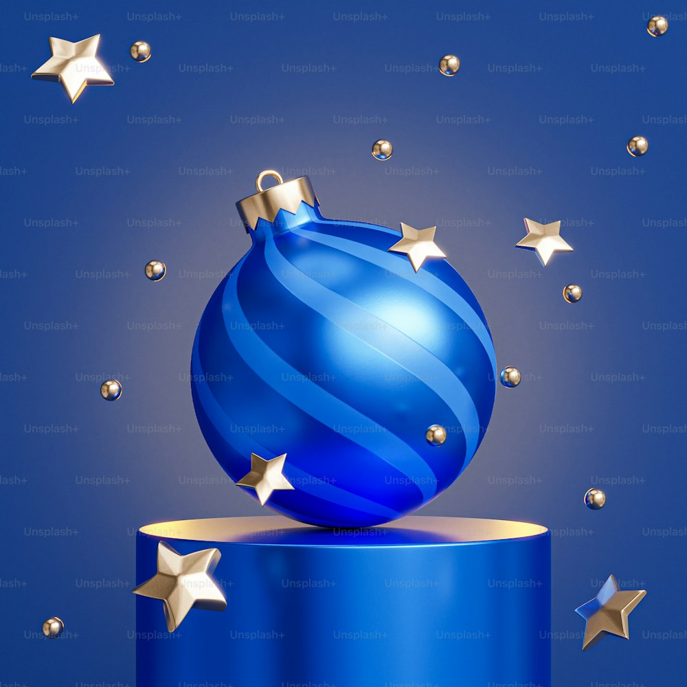 a blue christmas ornament sitting on top of a blue box