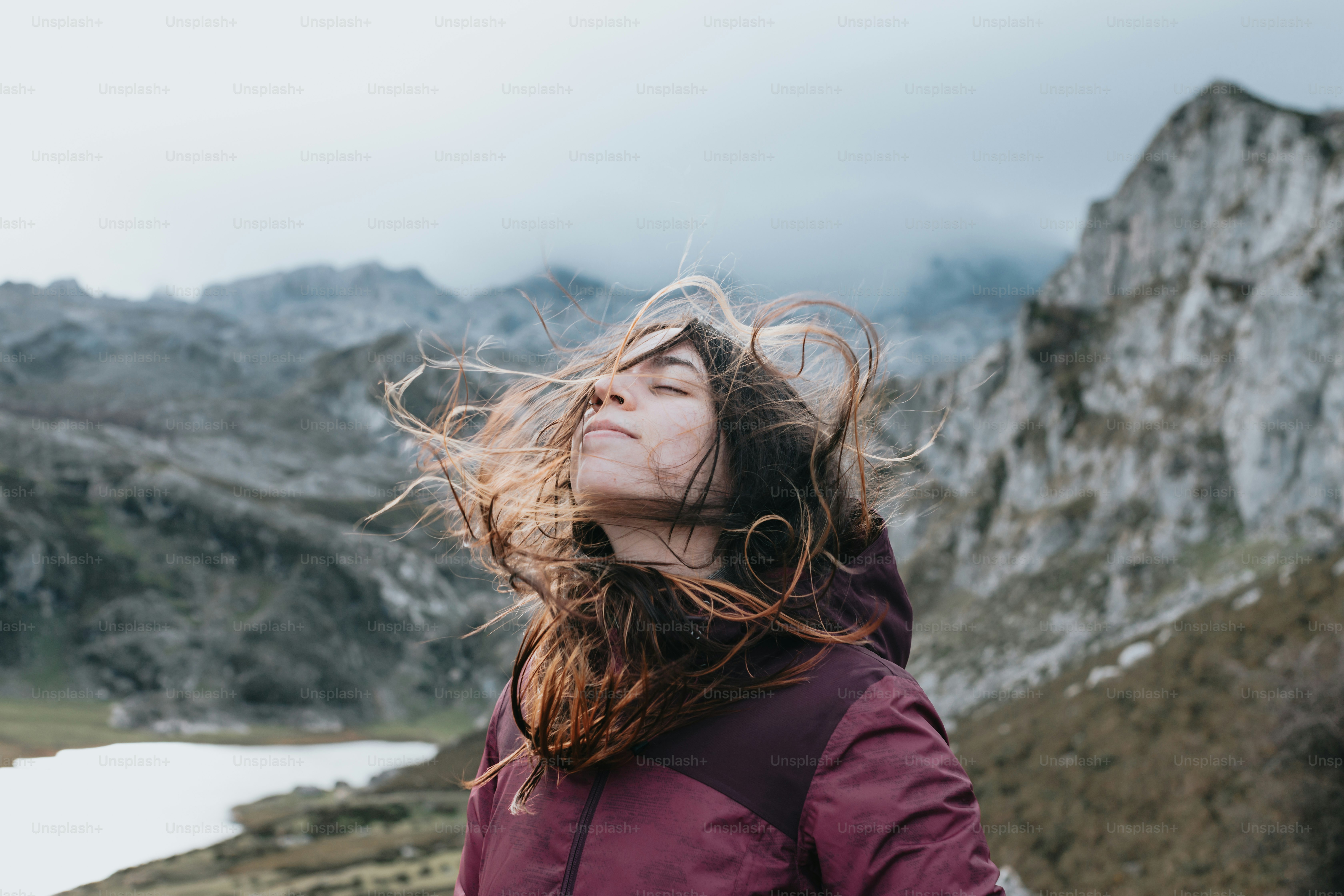 A woman with her hair blowing in the wind photo – Travel Image on Unsplash