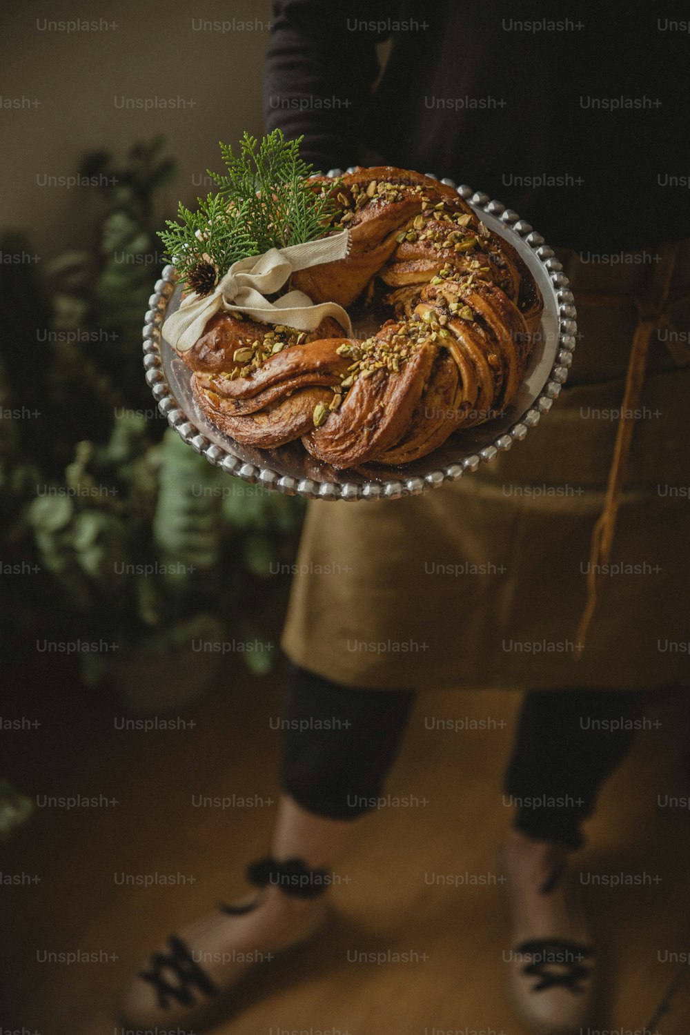 a person holding a plate with food on it