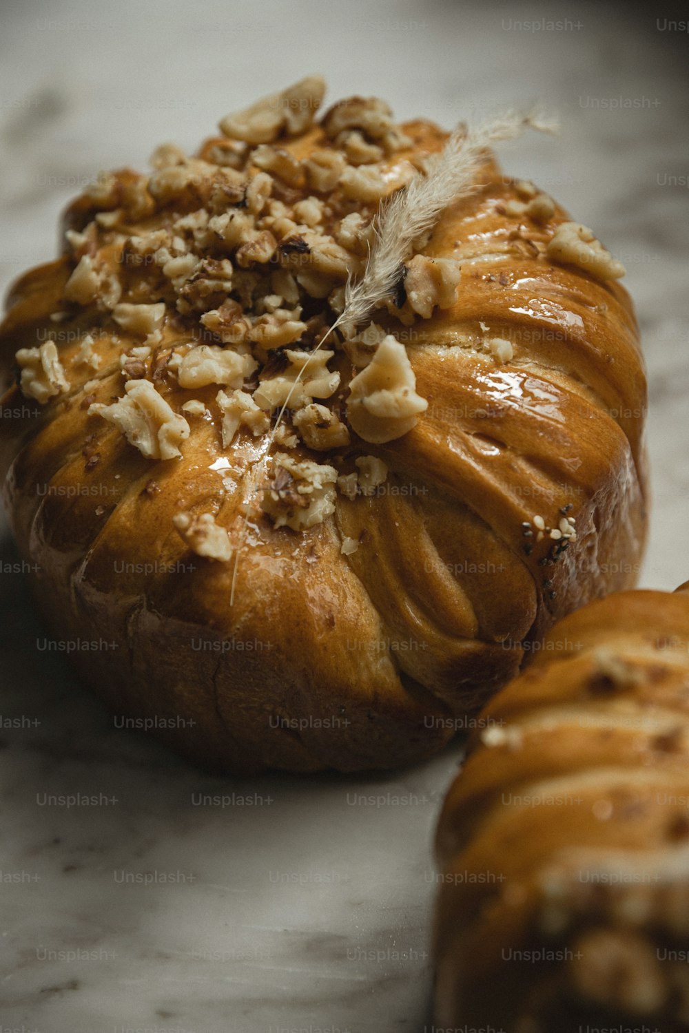 a loaf of bread with nuts on top of it