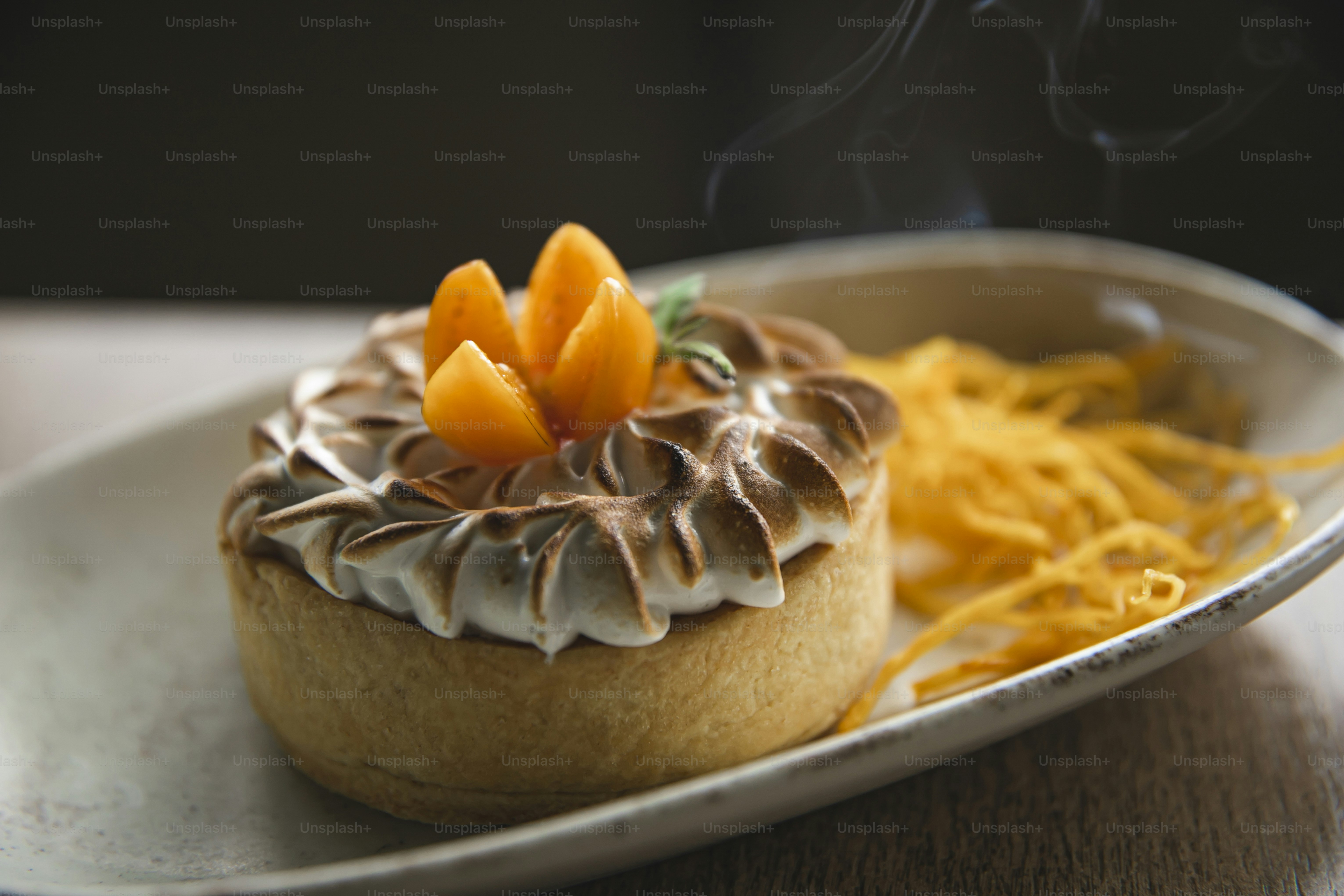 a plate with a pastry on it and a cup of coffee