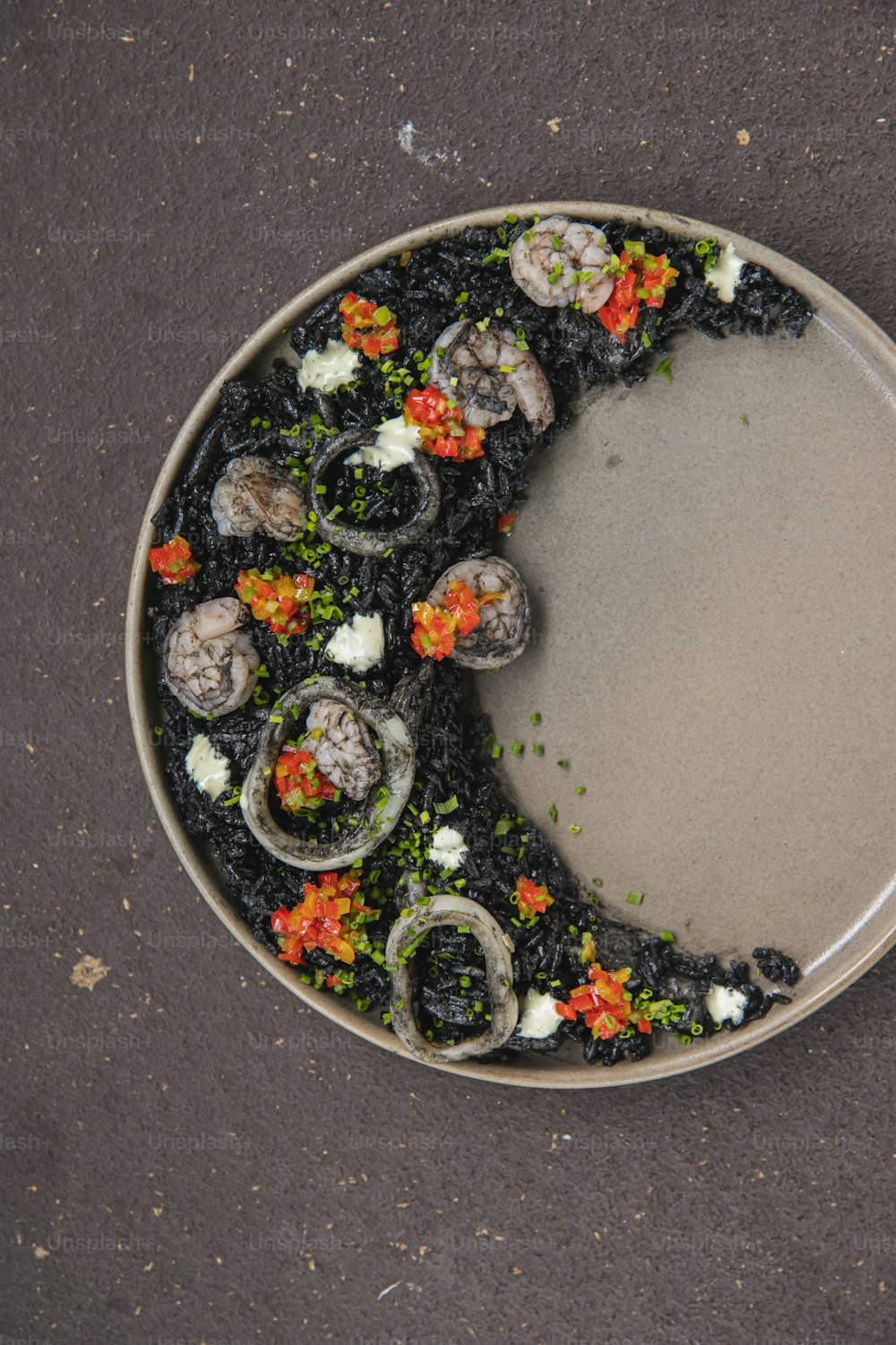 a plate of food with a crescent of food on top of it