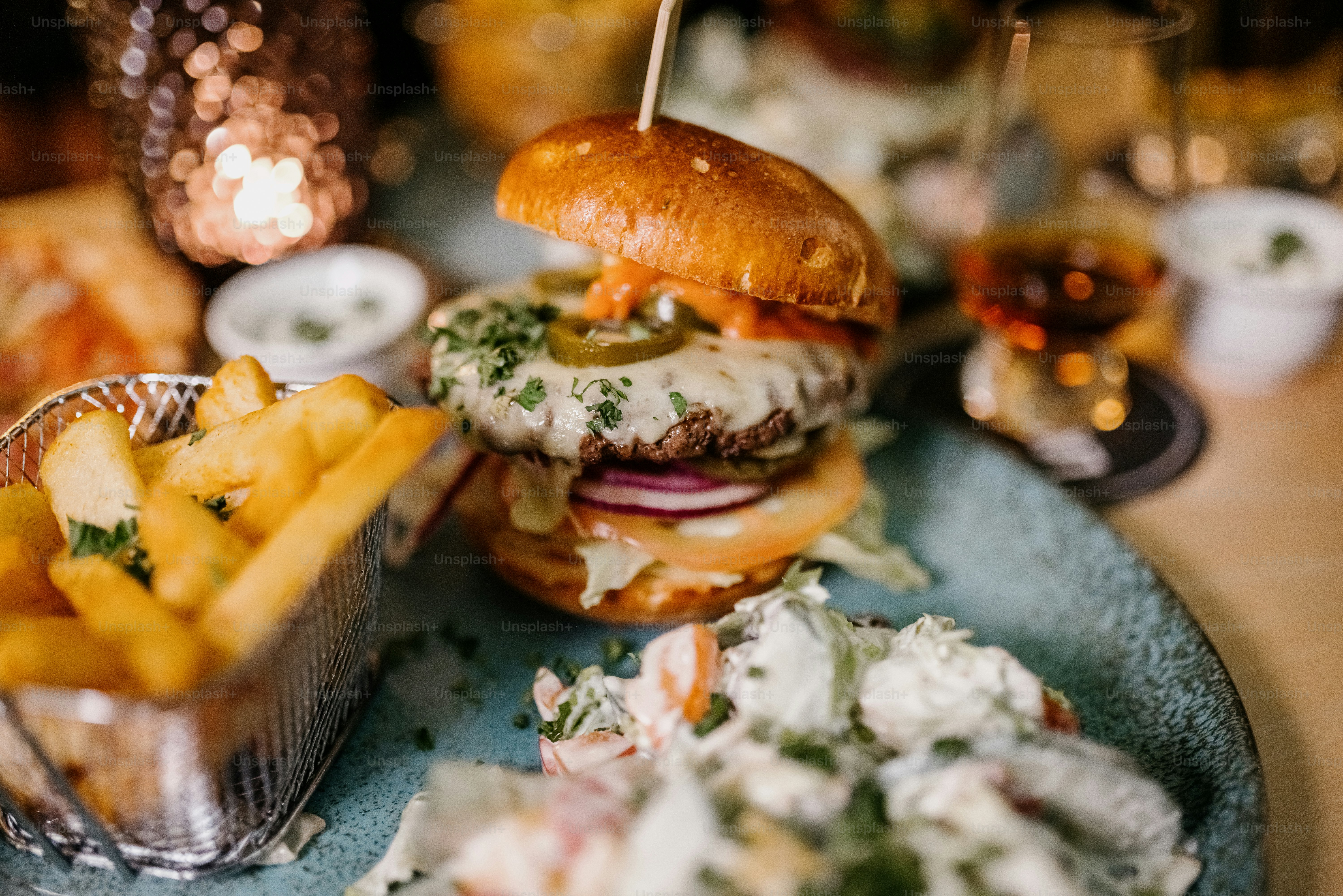 a plate with a hamburger and fries on it