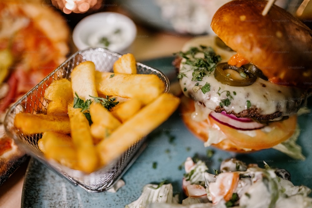 a hamburger and french fries on a plate