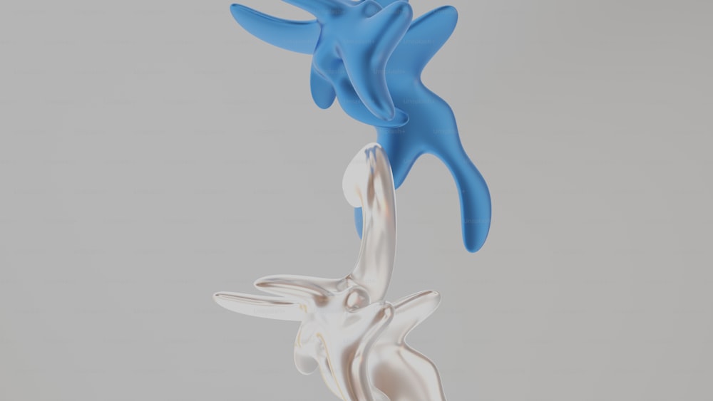 a sculpture of two blue and white birds