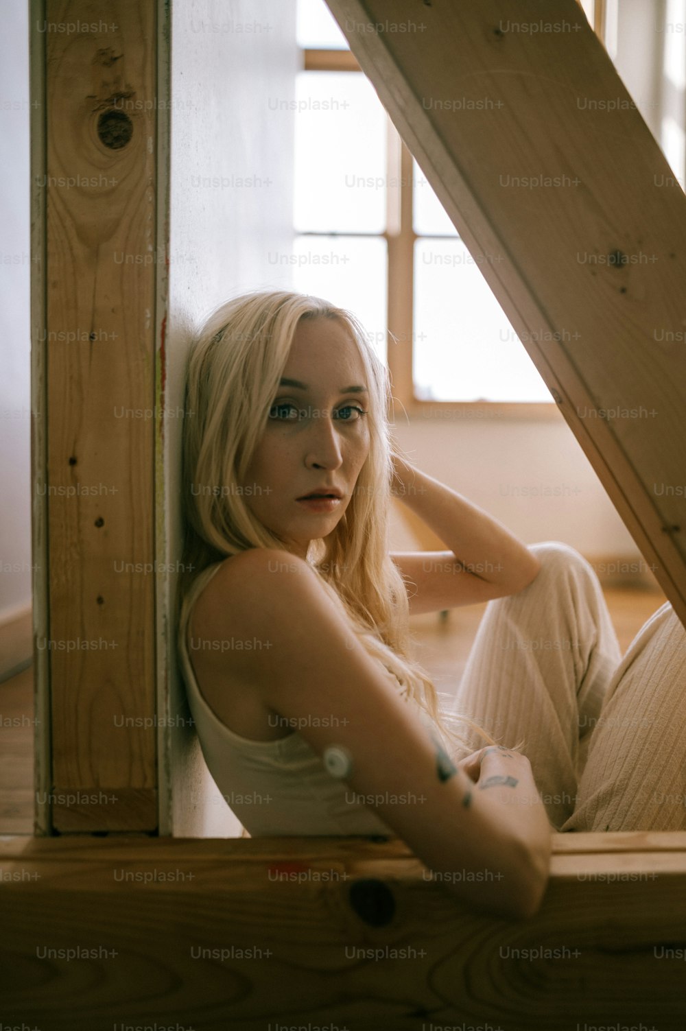 a woman sitting on the floor of a room