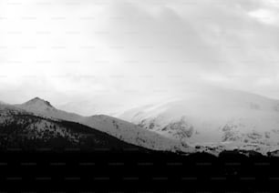 a black and white photo of a mountain range