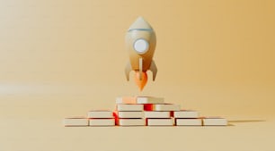 Un cohete vuela sobre una pila de libros
