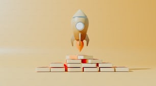 a rocket is flying over a stack of books