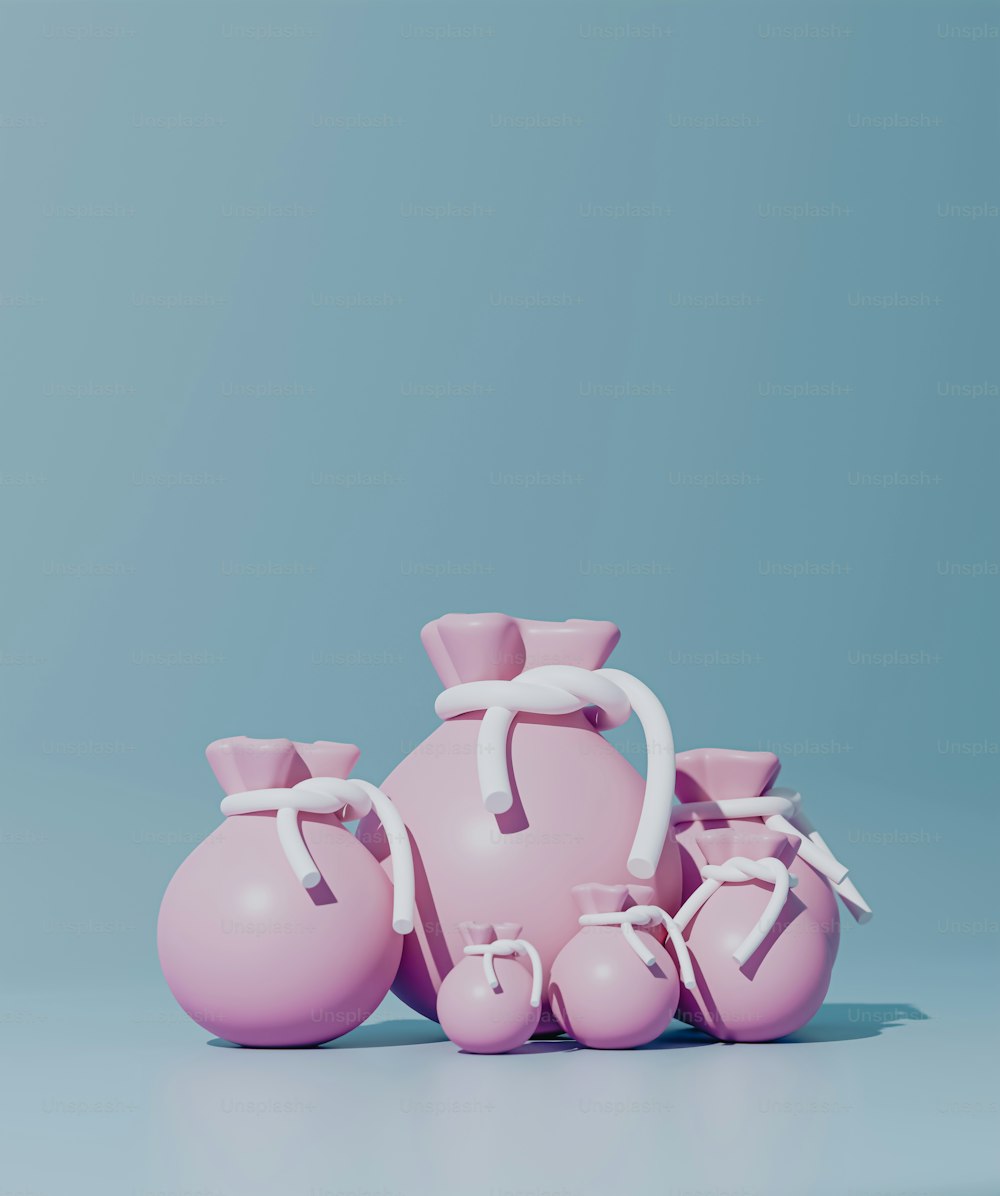 un gruppo di vasi rosa seduti uno accanto all'altro