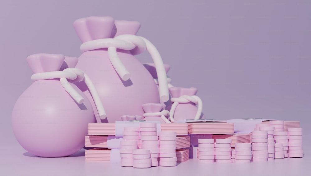 um vaso rosa sentado ao lado de uma pilha de blocos cor-de-rosa