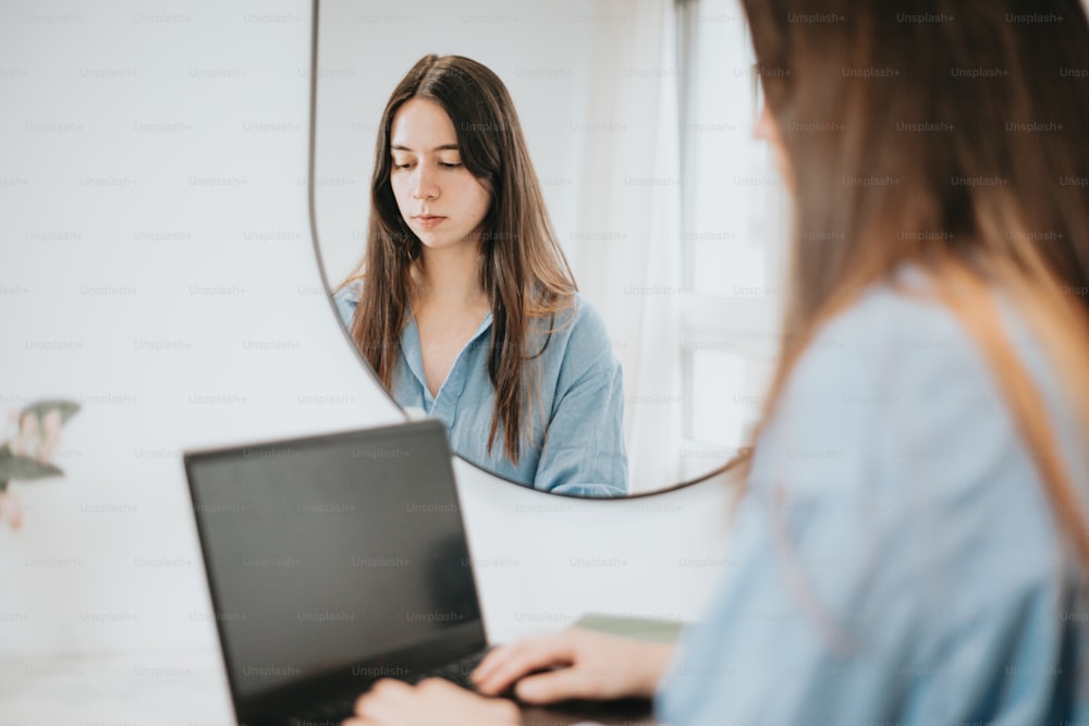 a person looking at a laptop