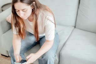 a woman sitting on a couch