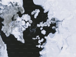 an aerial view of ice floes and water