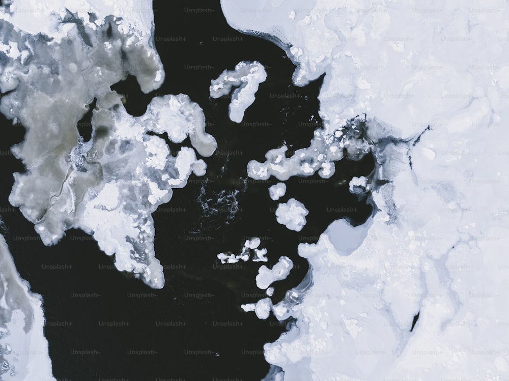 an aerial view of ice floes and water