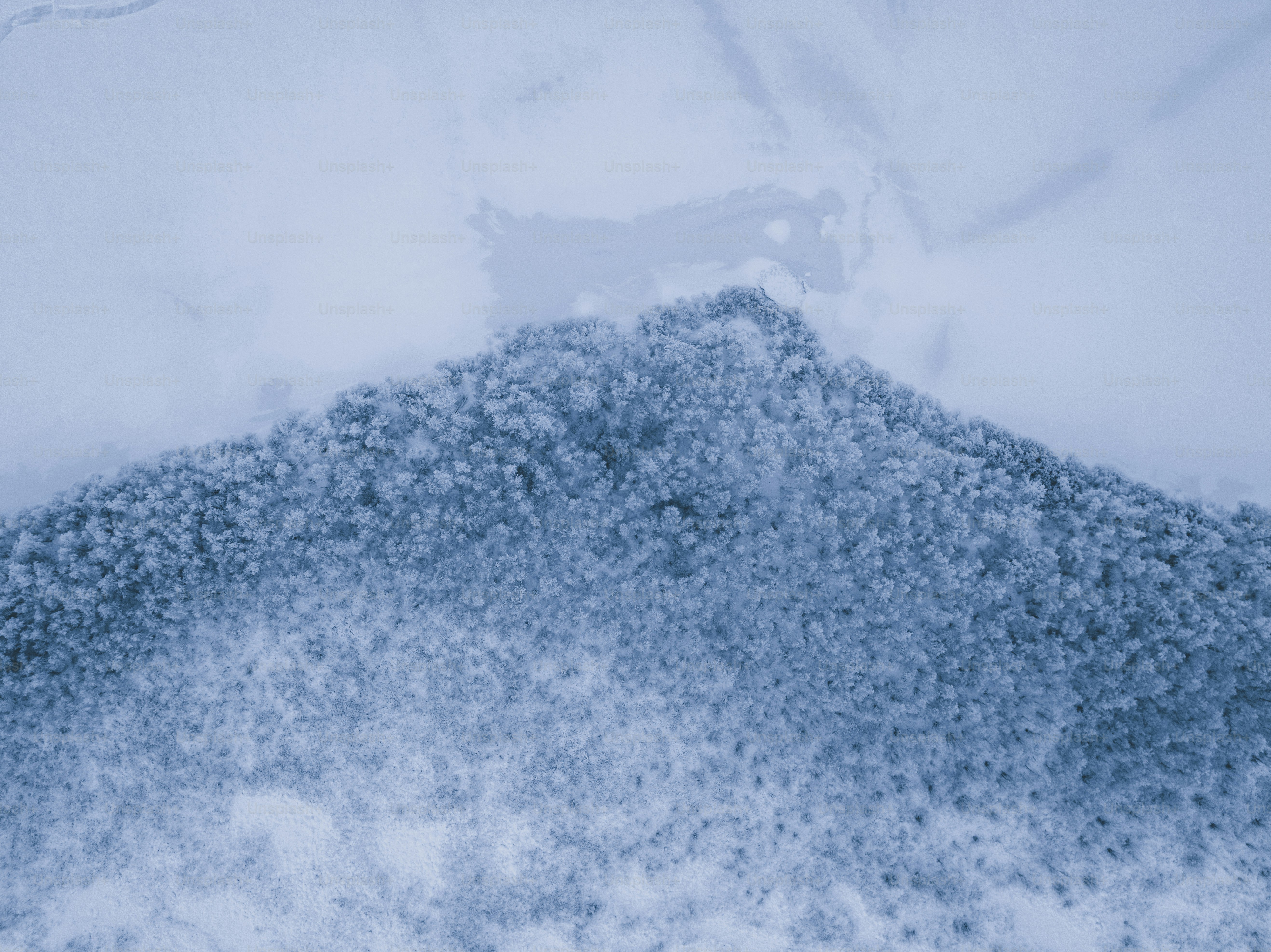 a snow covered area with a snowboard in the middle of it