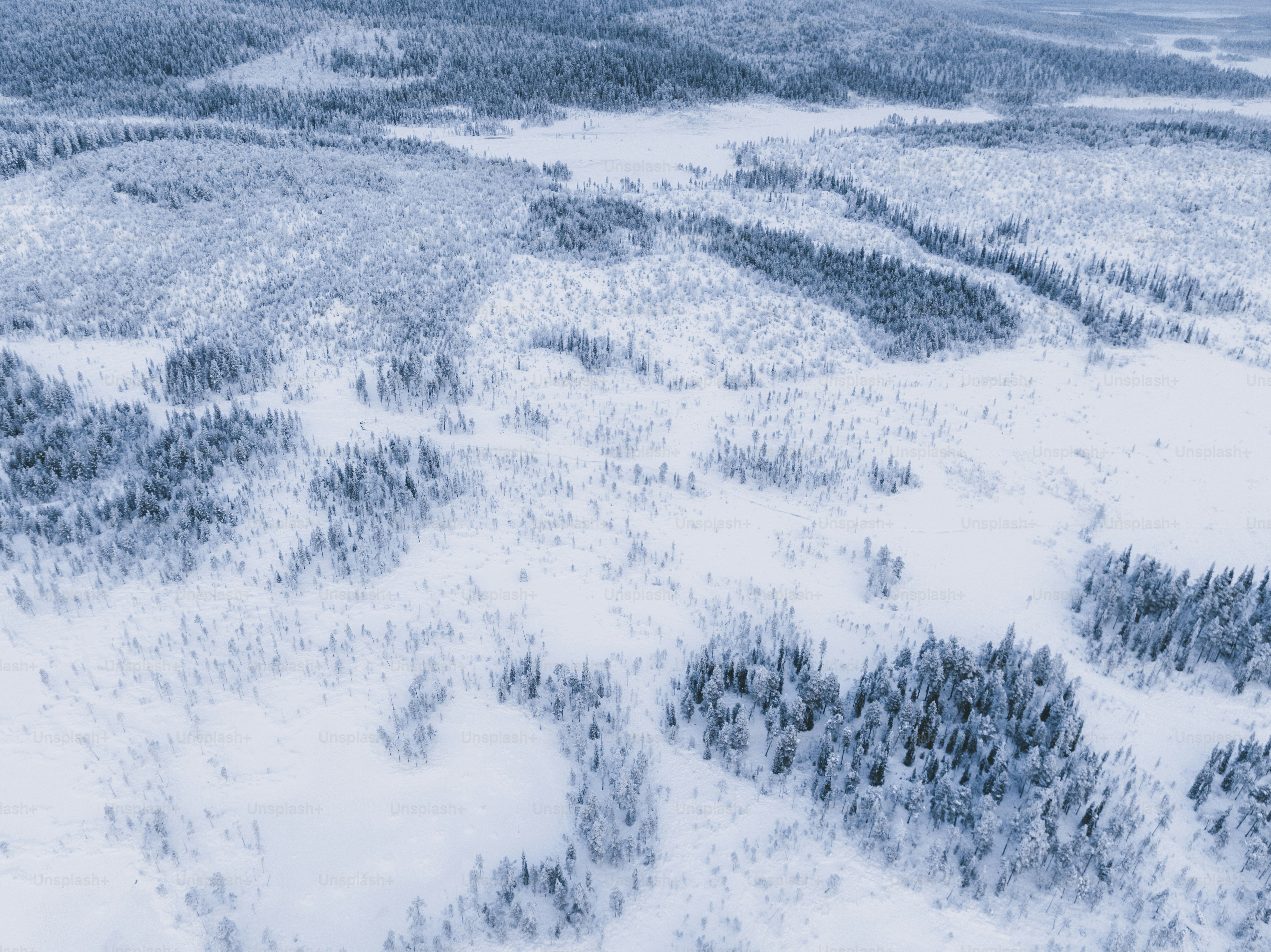An aerial view of a snow covered road photo – Trainline Image on Unsplash