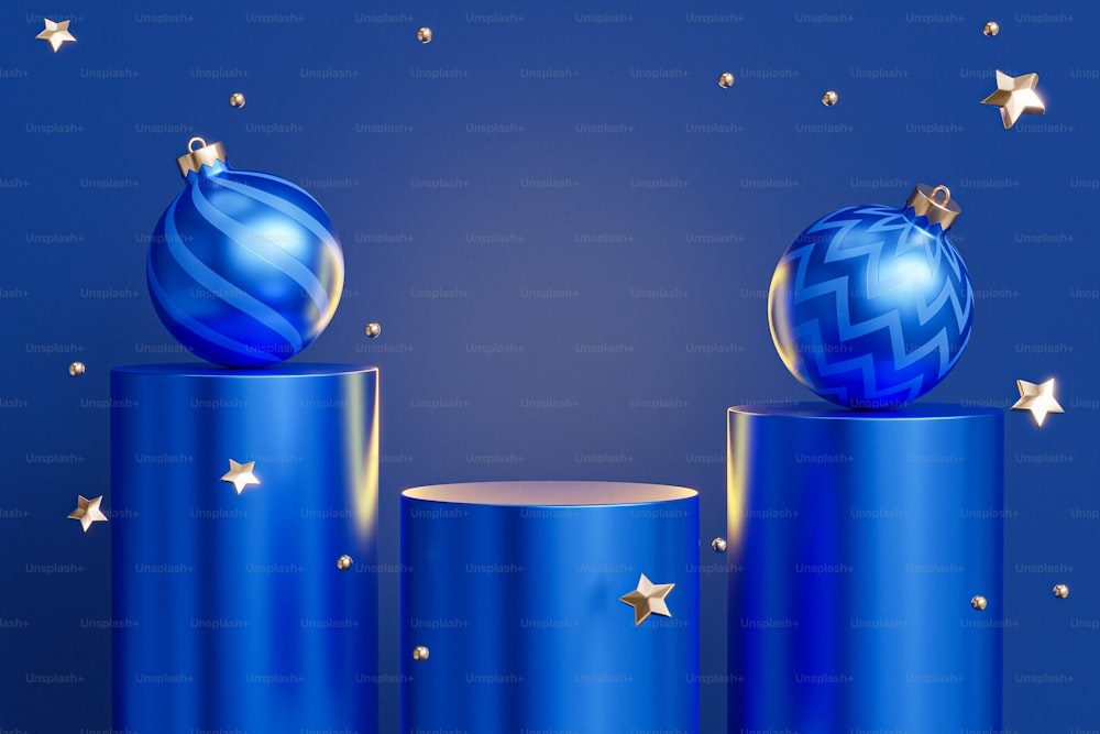 파란색 실린더 위에 앉아 있는 파란색 크리스마스 장식