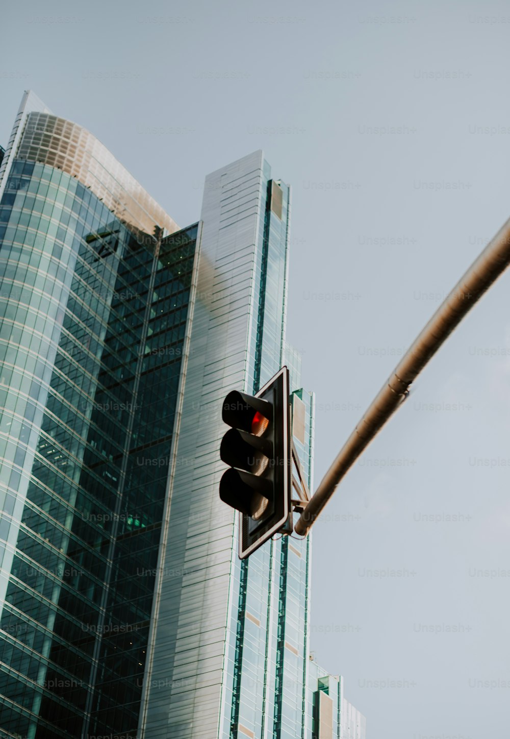 a traffic light in front of a tall building