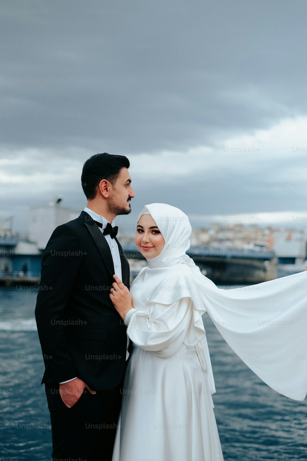 a man and a woman standing next to each other