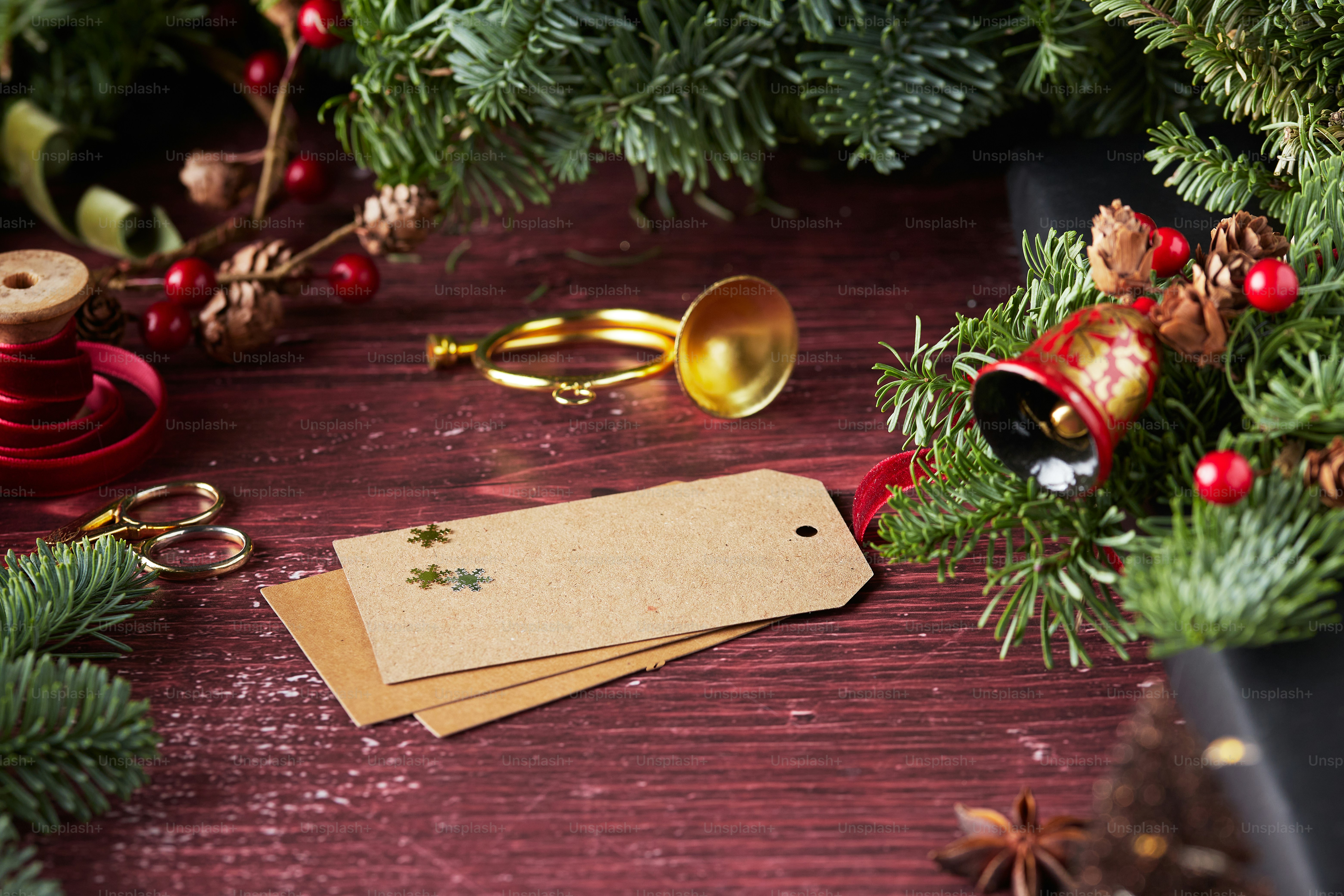 a wooden table topped with lots of christmas decorations