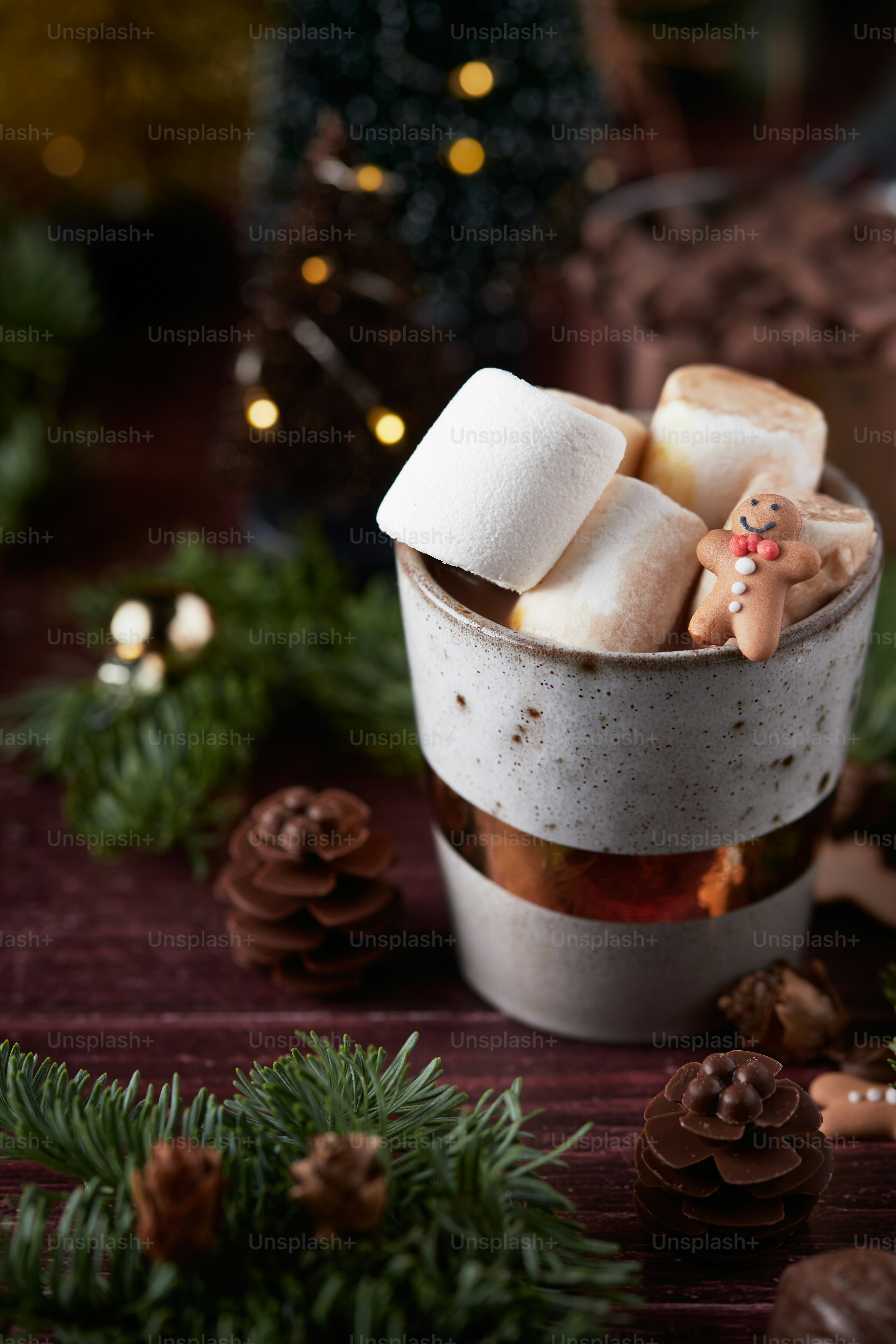 a cup filled with marshmallows on top of a table