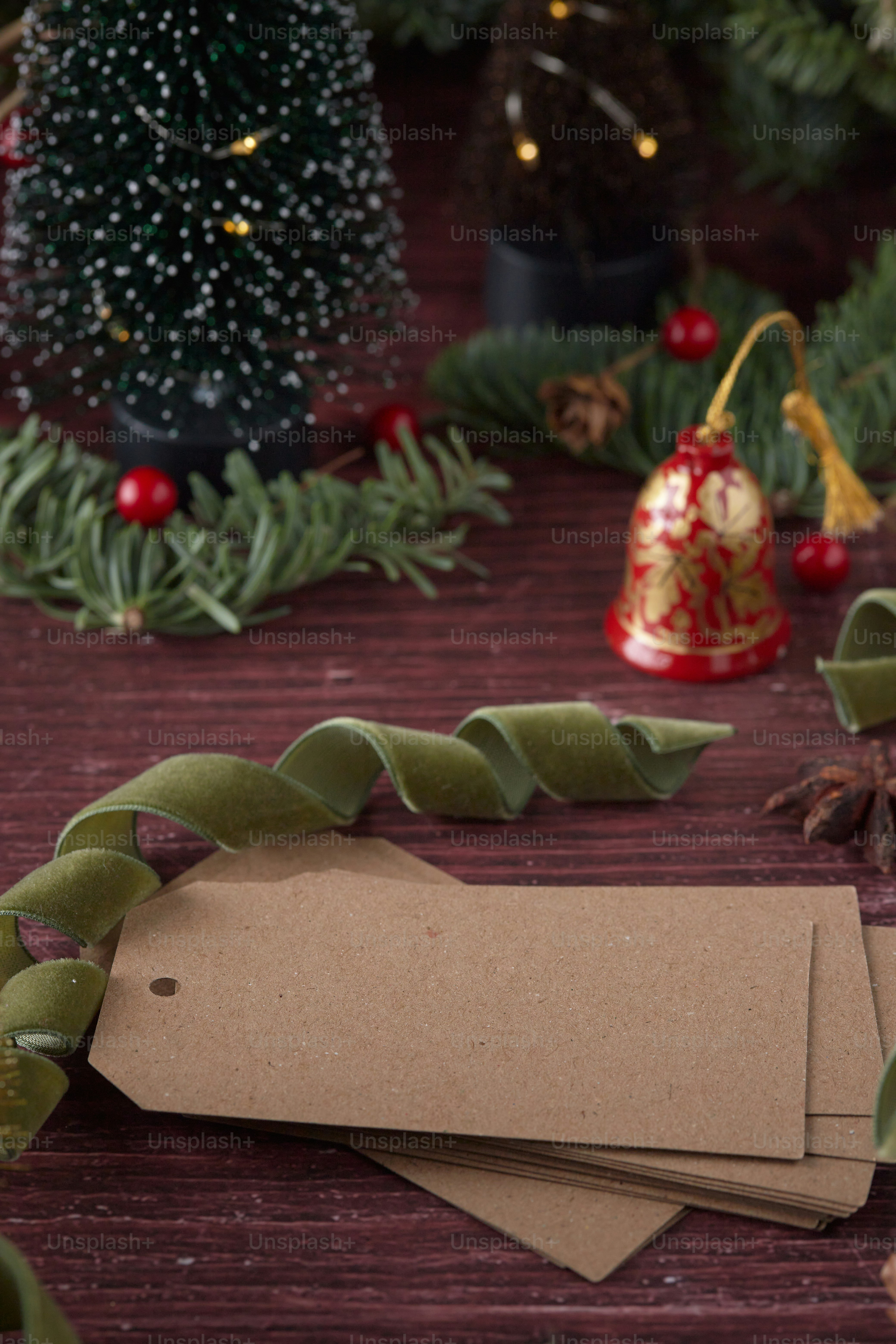 a wooden table topped with lots of christmas decorations