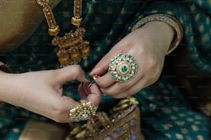 a person holding a necklace