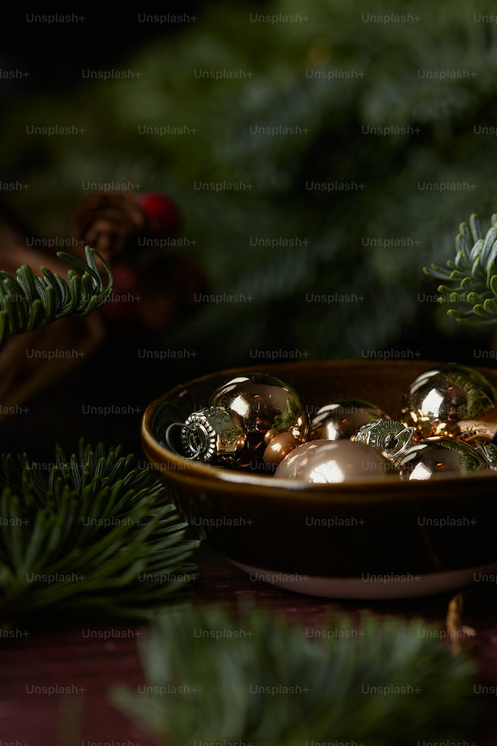 a bowl of gold and silver jewelry