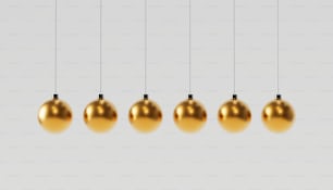 a group of gold balls hanging from a line