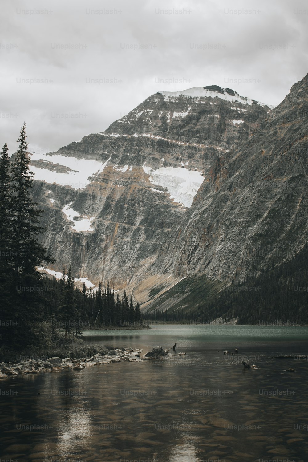 a lake with mountains in the background