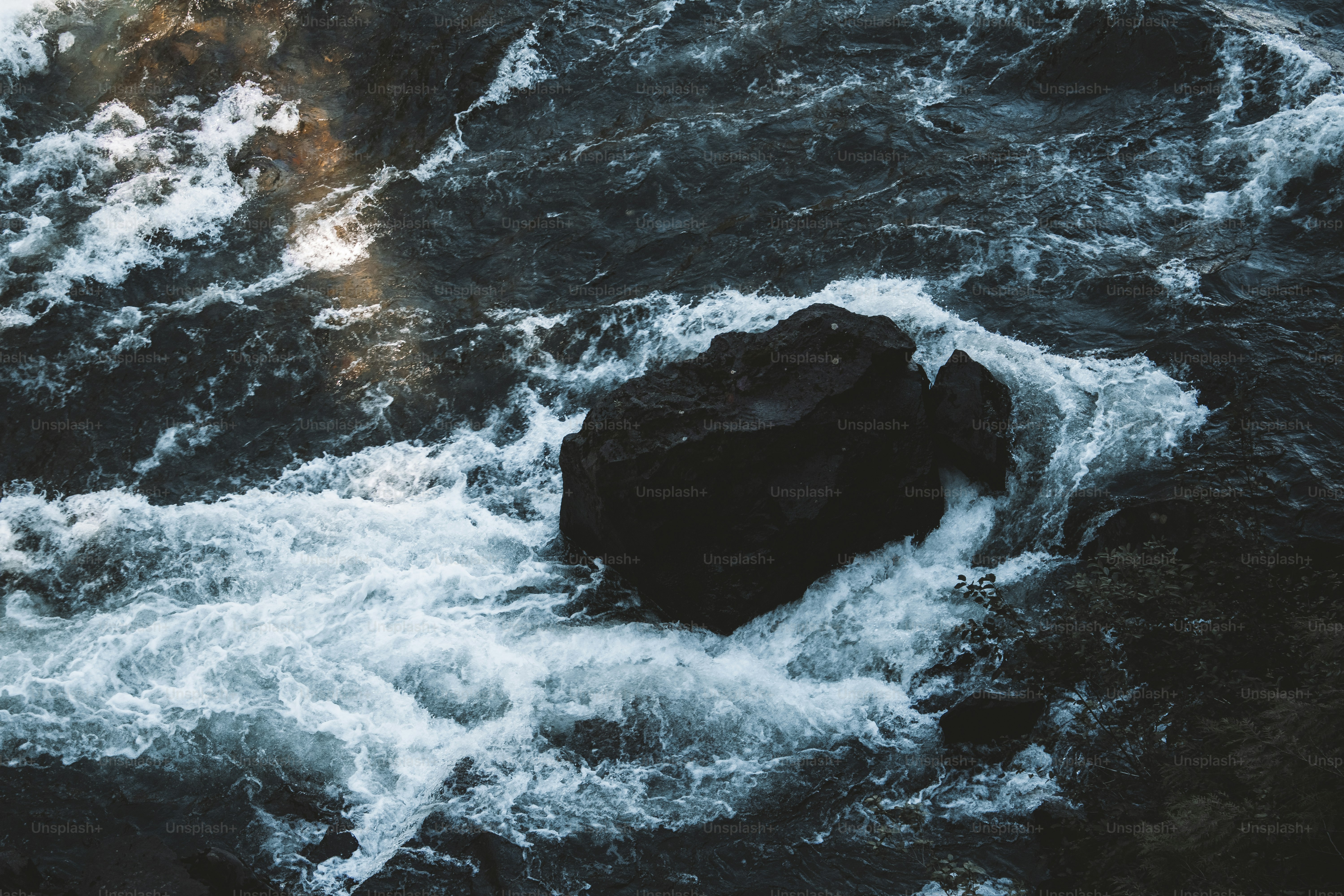 a rocky area with water flowing over it