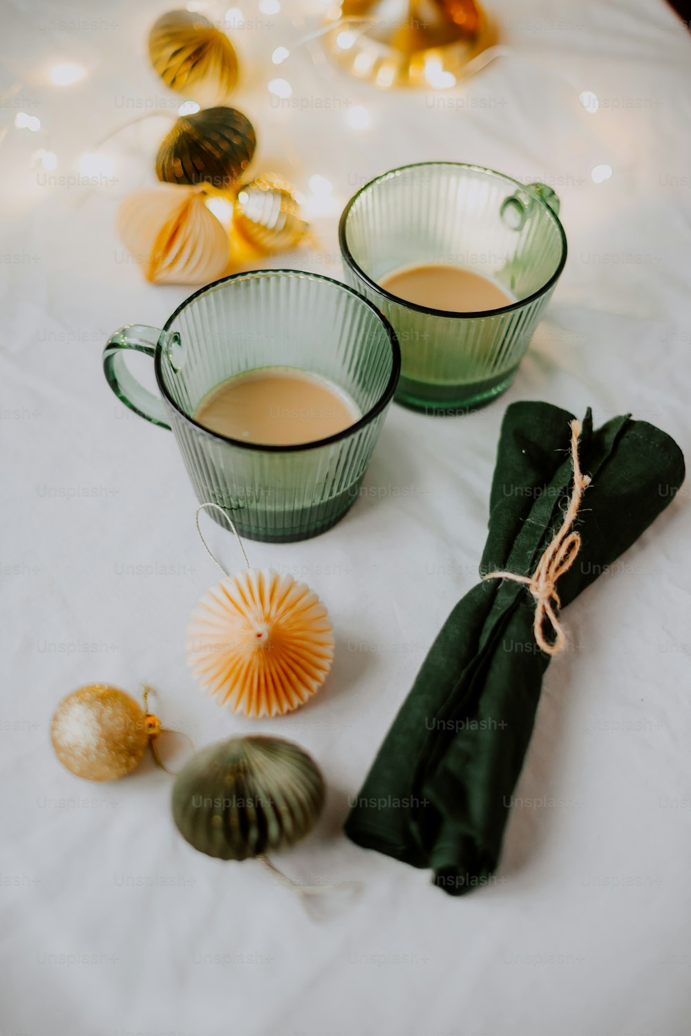 a group of tea cups with tea