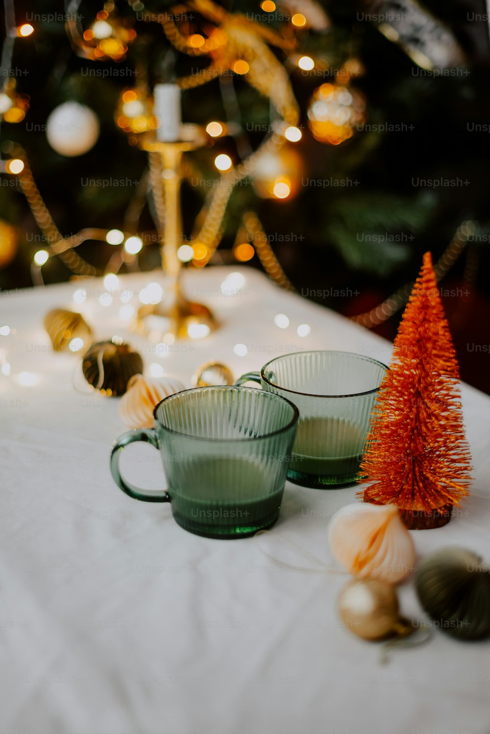 a couple of tea cups sit on a table