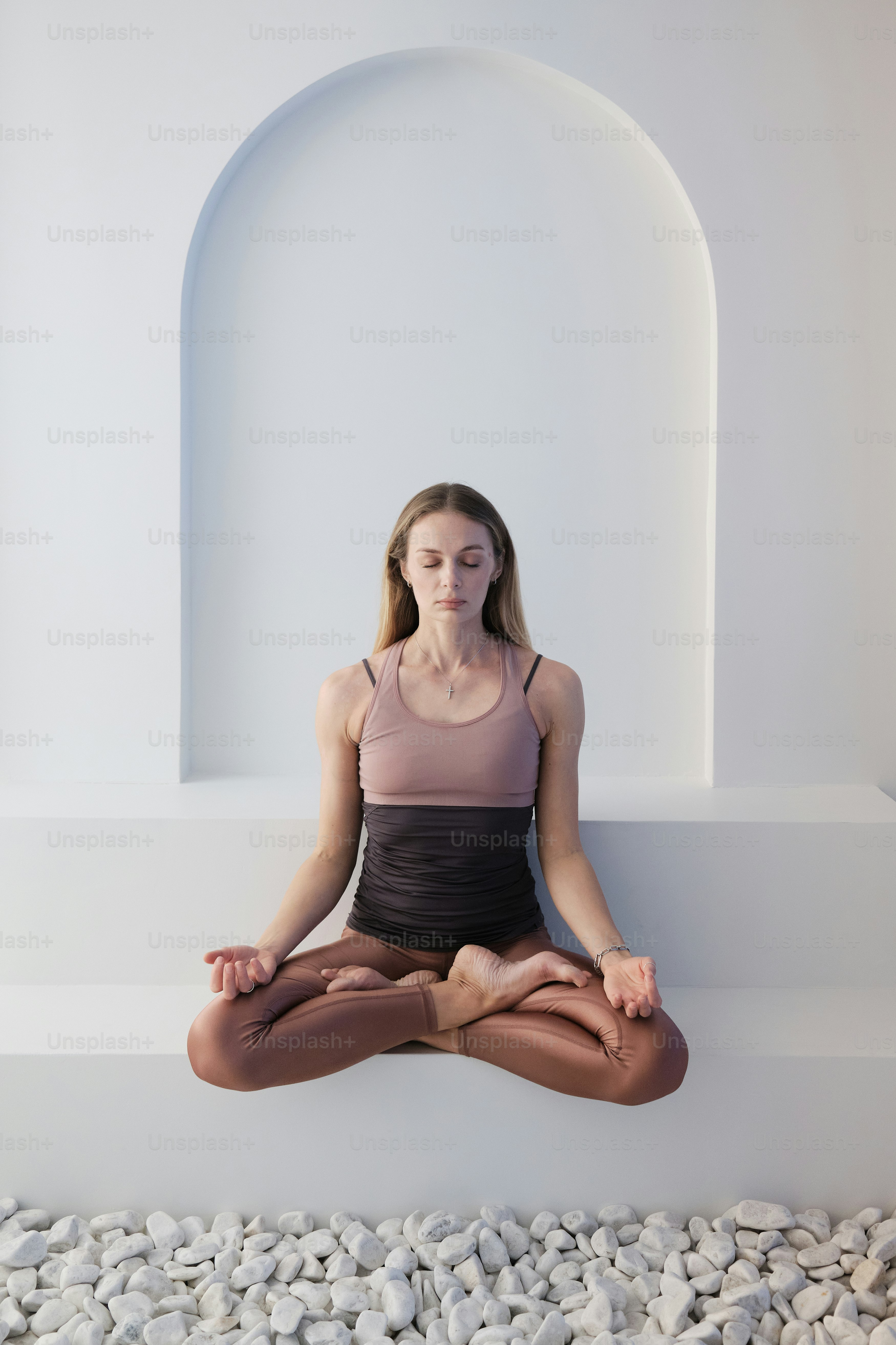 A beautiful young woman doing yoga practice. Meditation lotus pose.