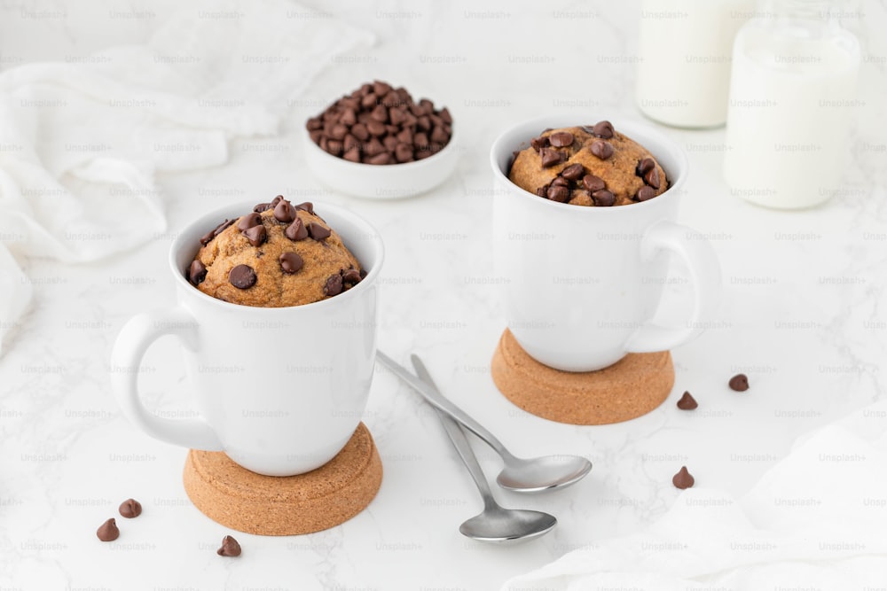 a group of coffee cups with chocolate chips and milk