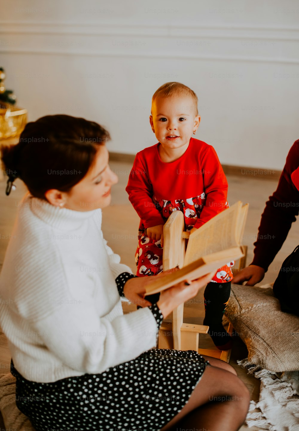 a person and a child sitting on a couch