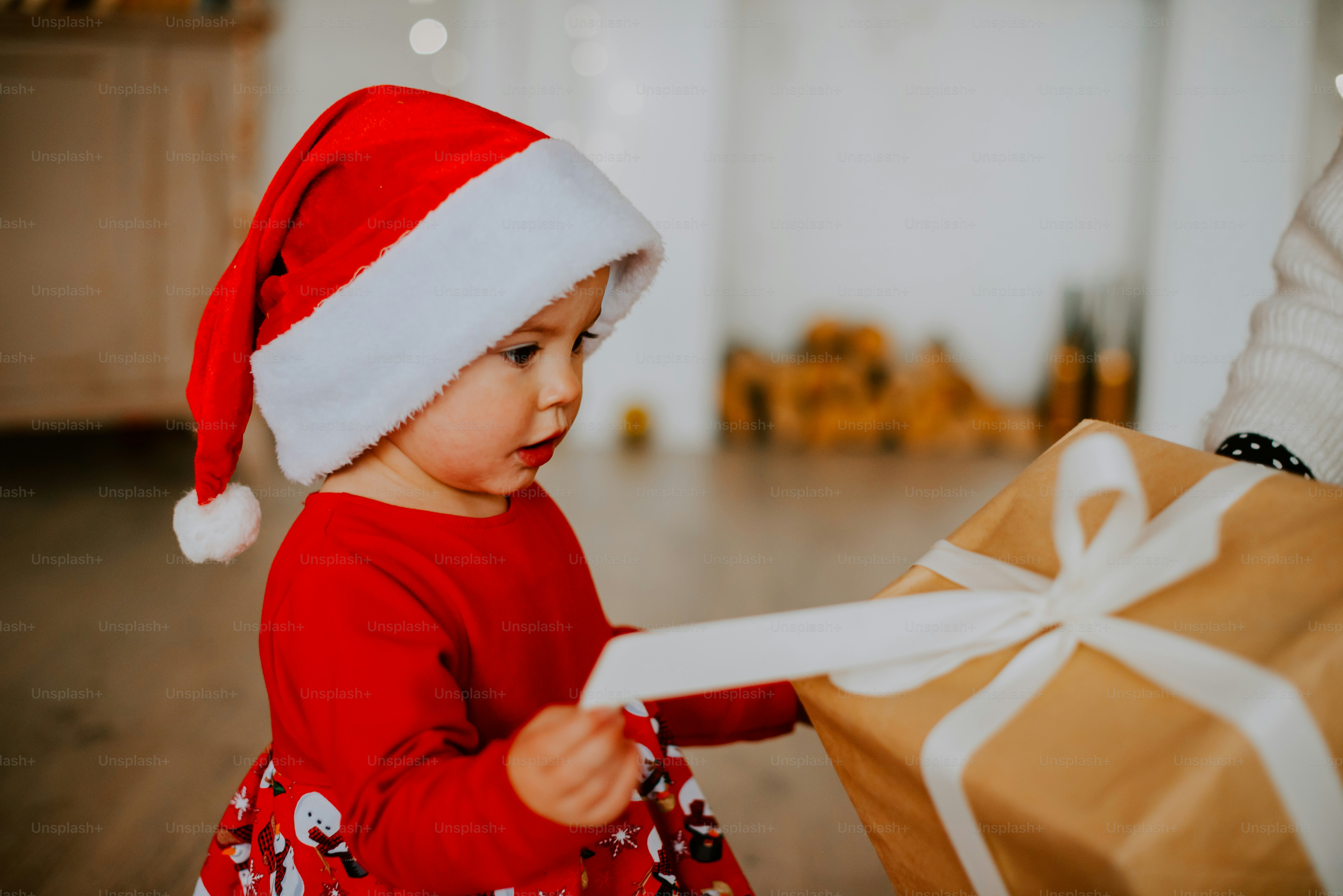 a child holding a shopping bag