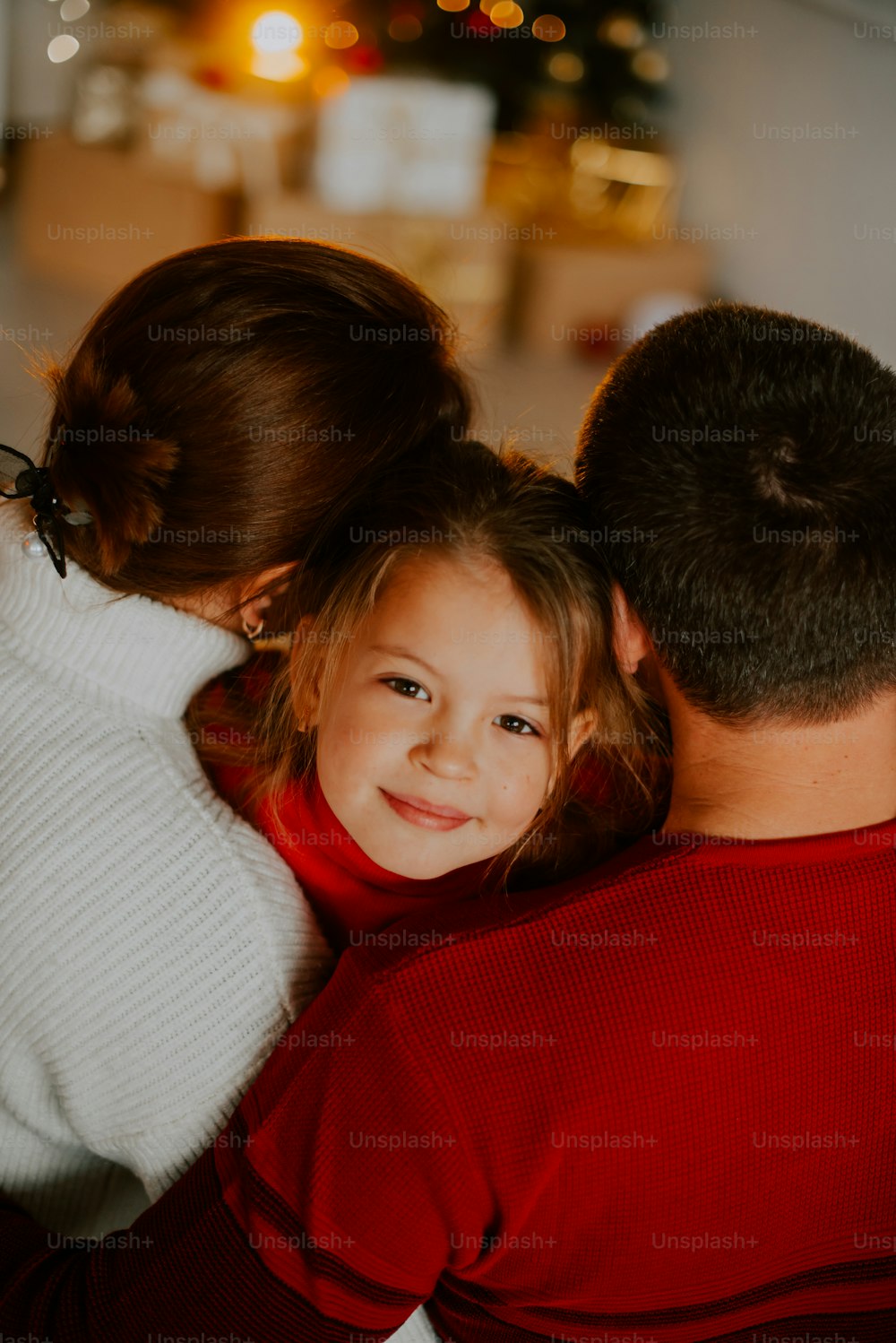 a woman kissing a man on the cheek