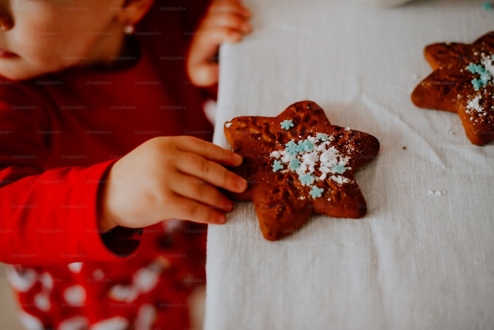 a person holding a piece of cake