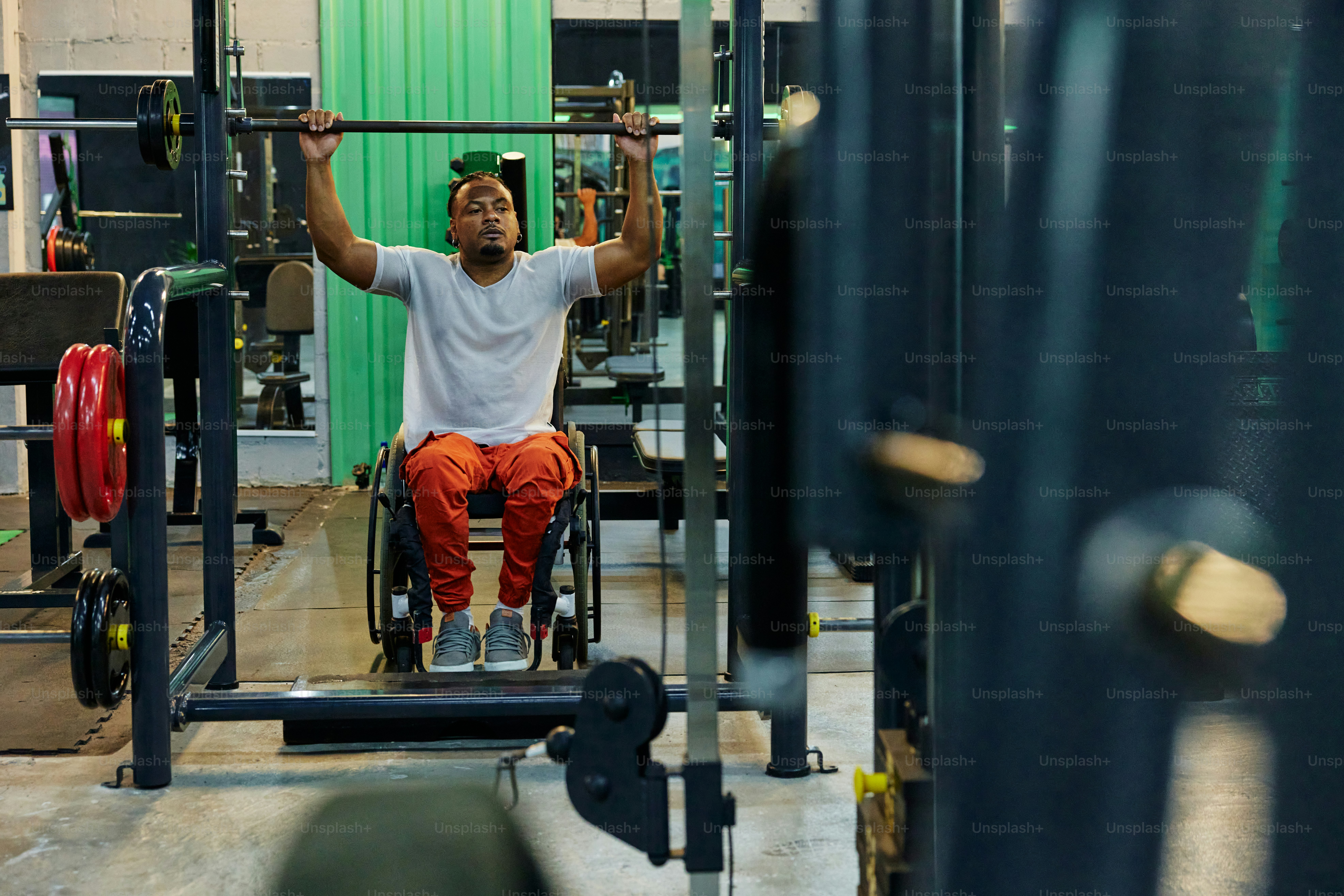 a man sitting on a barbell