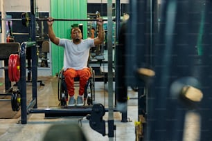 a man sitting on a barbell