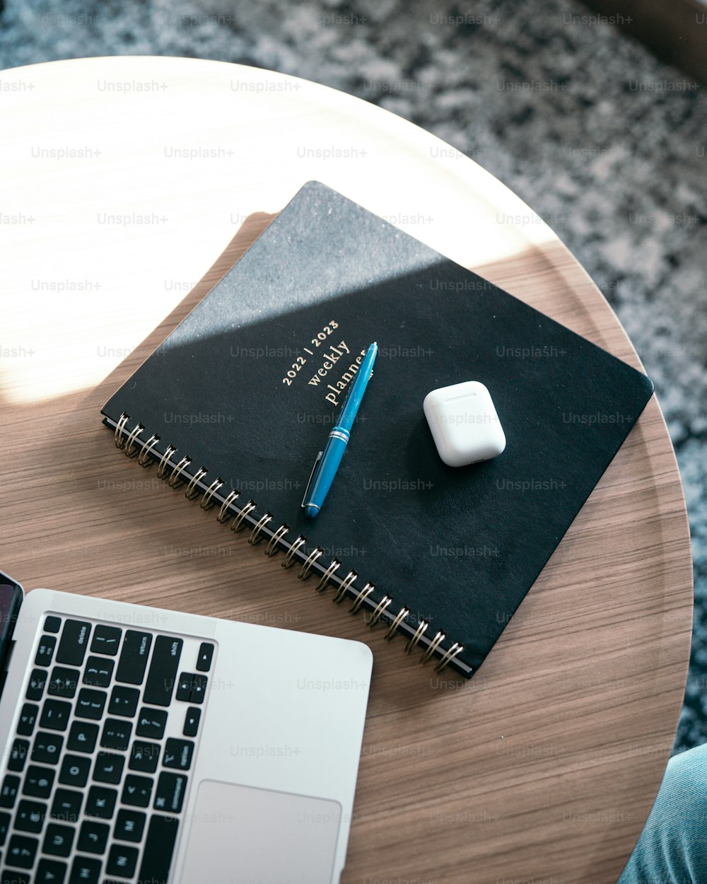 a black box with a white mouse on a white surface