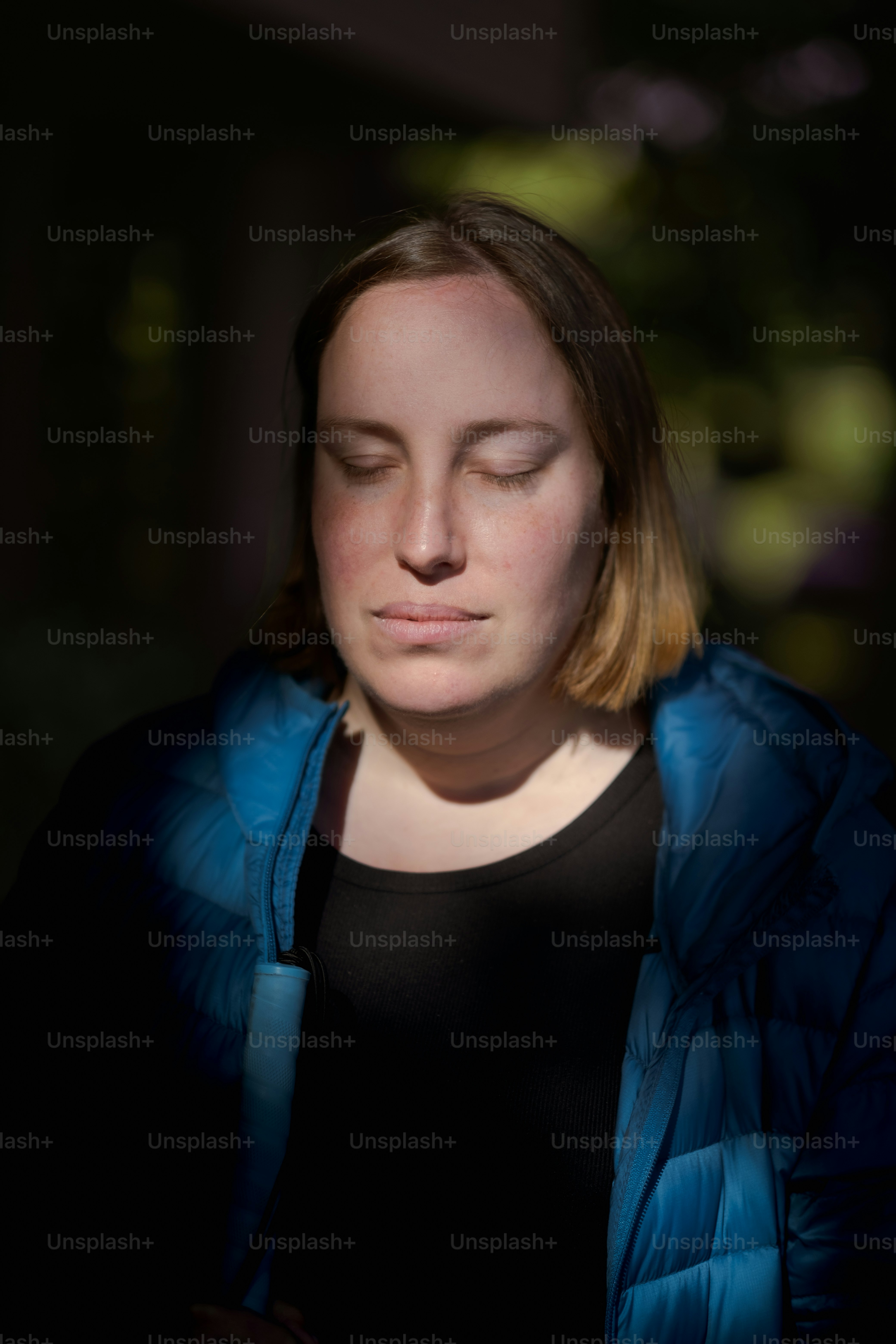 a woman with her eyes closed