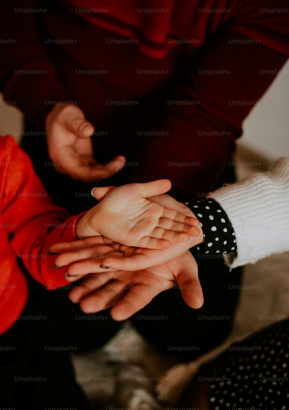 a close-up of hands shaking