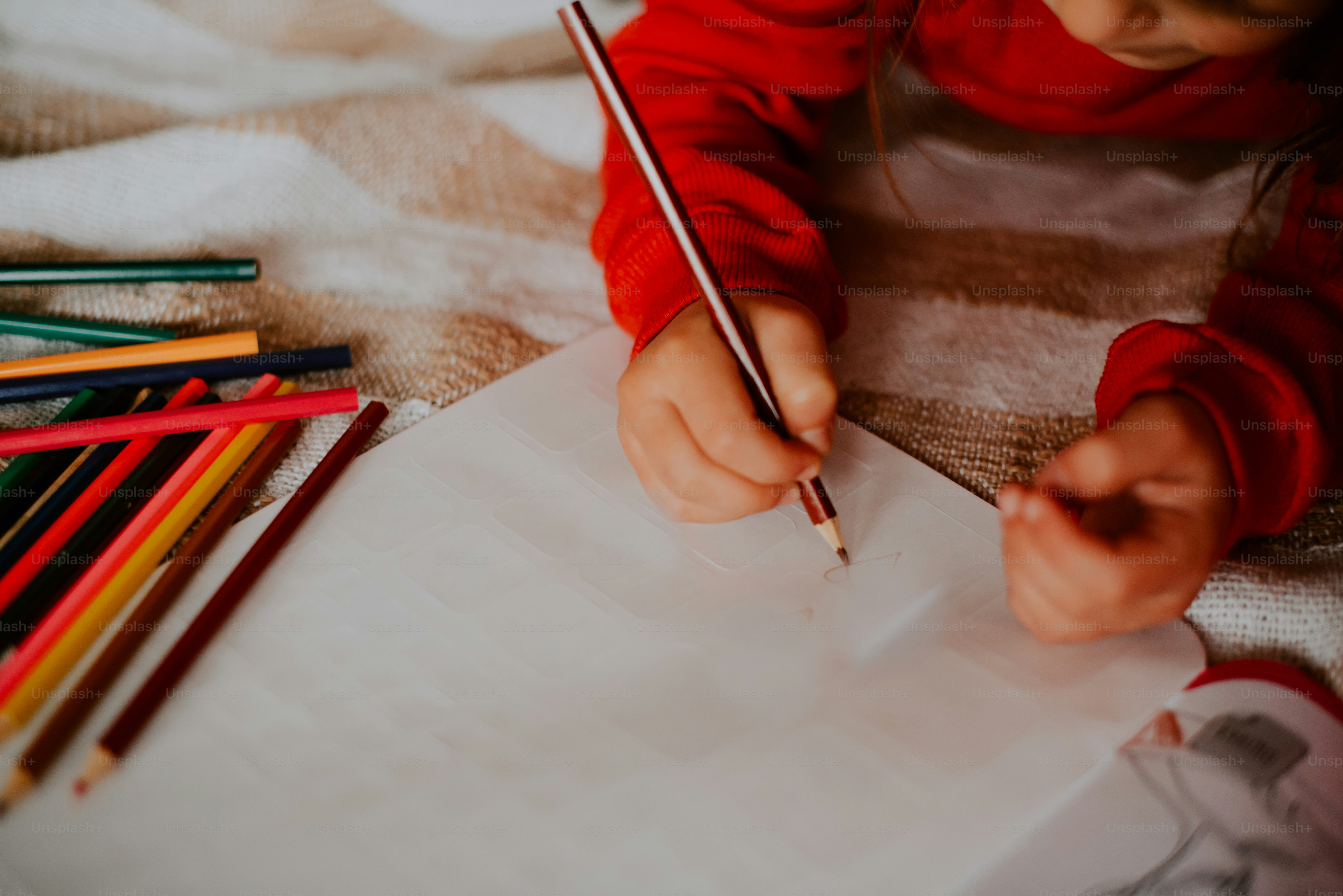 a person cutting a piece of paper