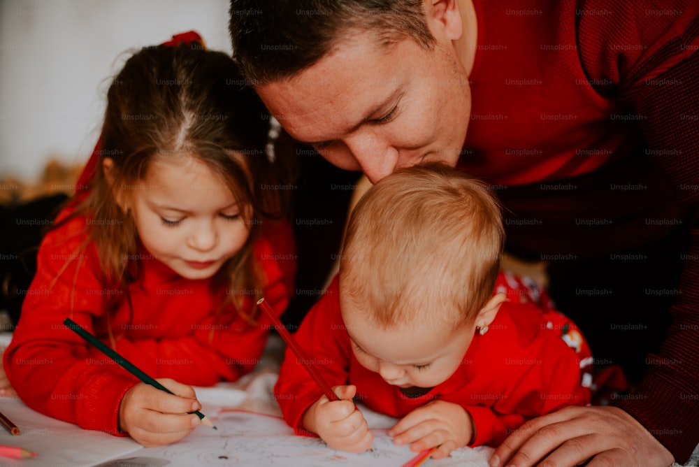 a man and a woman looking at a child