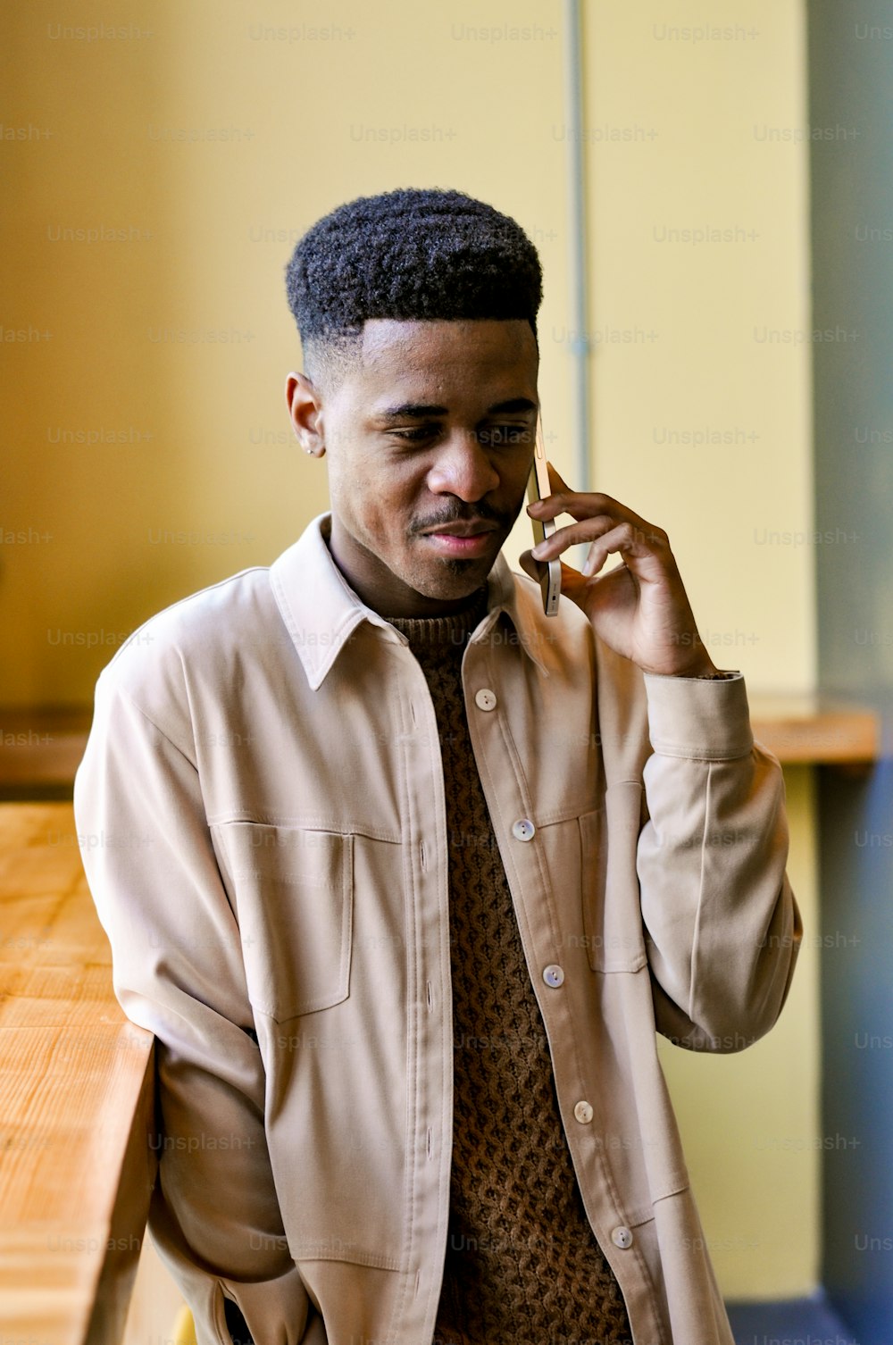 a man talking on a cell phone